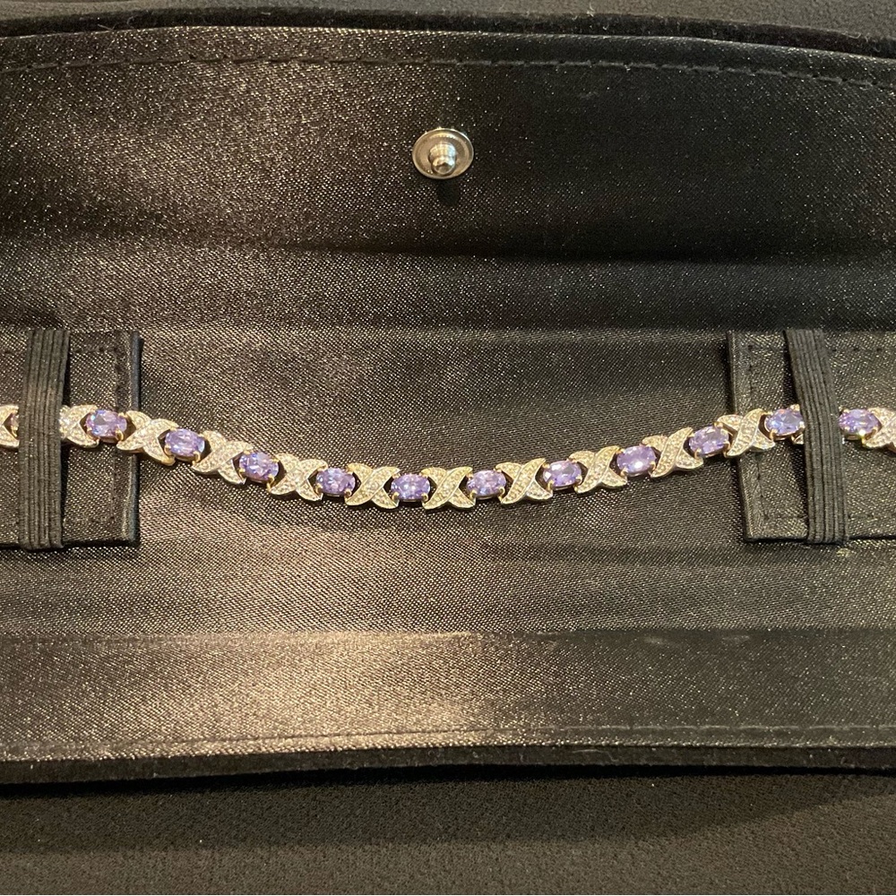 NWOT Bracelet with Purple Stones & Crystals. 7.5” Gold Color Setting